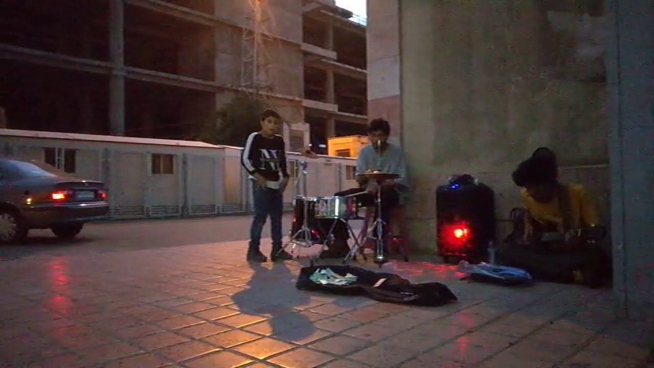 A Small Progressive Rock Band Plays Songs Outsides Of Metro Station in Tehran