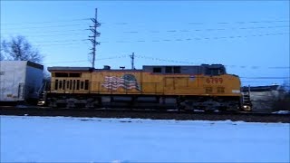 UP 6799 a fresh repainted C44AC leads a manifest in Geneva IL