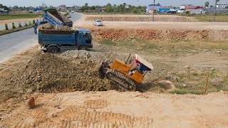 New Project Just Started Filling Land Use Dump Truck ,Bulldozer Push Stone in lot Next national road