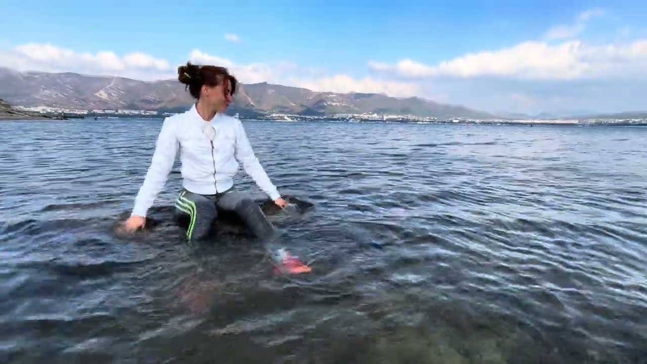 swimming in the sea in a white windbreaker #swimclothes