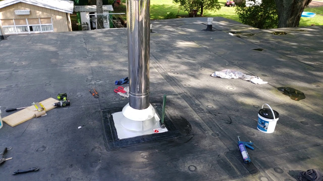 Woodstove and Chimney insulation to a flat rubber roof dwelling(1) - YouTube