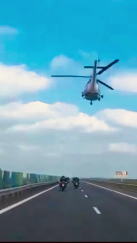 Police on the highway with helicopter