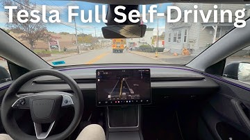 Tesla FSD V14.1.2 avoids an object in the road, then stops for a bus