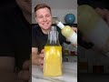 Orange creamsicle jungle juice in a bottle