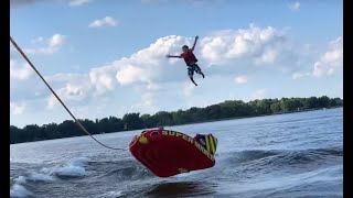 Kid ejected off tube behind surf boat (slow motion) screenshot 5