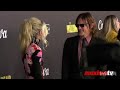 Emily kinney and norman reedus at the walking dead episode 1124 rest in peace red carpet