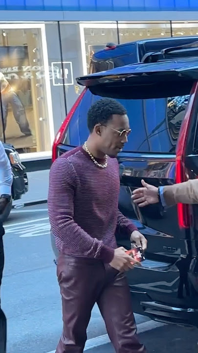 Tyler James Williams is street cool in red leather pants #tylerjameswilliams #mensstyle #gma