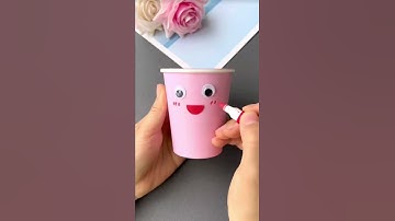 You can make a cute coin piggy bank for your child with a disposable paper cup, let