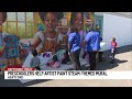 Kids help artist paint STEAM-themed mural in Hartford