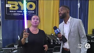 Checking out the Build Your Own Lightsaber booth at Motor City Comic Con