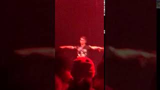 Guy T-posing at a furry rave