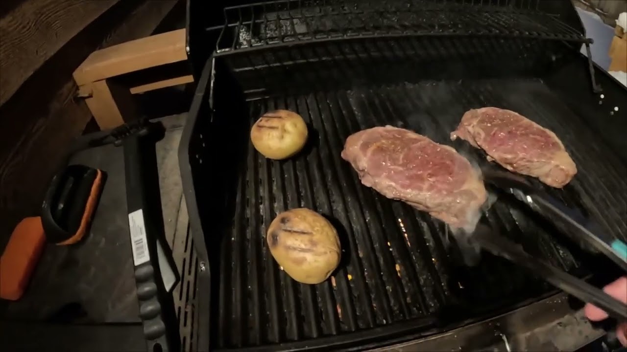 Picture perfect snow scene. Plowing snow. Grilling some thick steaks.