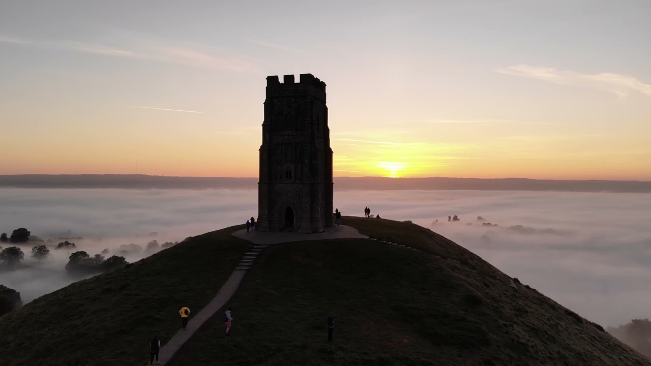 4K HD Stunningly Beautiful Mist flowing over the Glastonbury Tor Tower Glastonbury Tor at Sunset
