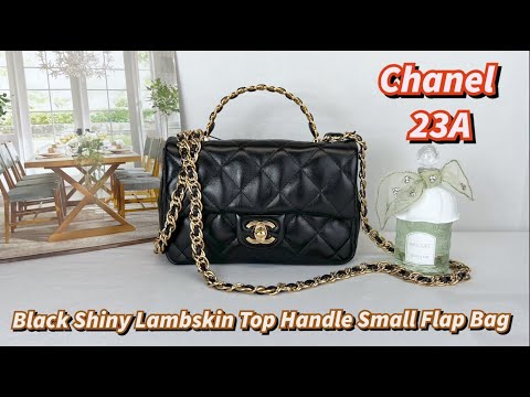 Flap bag with top handle, Lambskin & gold-tone metal, black — Fashion