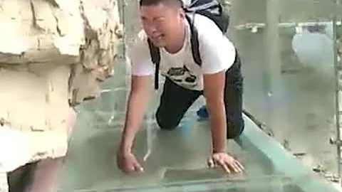 Raw: Tourists Brave Glass-Bottom Bridge