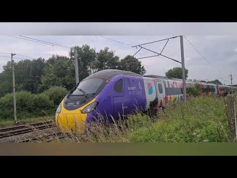 Avanti West Coast - 390119 Progress (Pride). Working 1M13 through Bamfurlong, Wigan. 10th July 2021