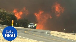 Wildfires rage across the US Plains leaving six dead - Daily Mail