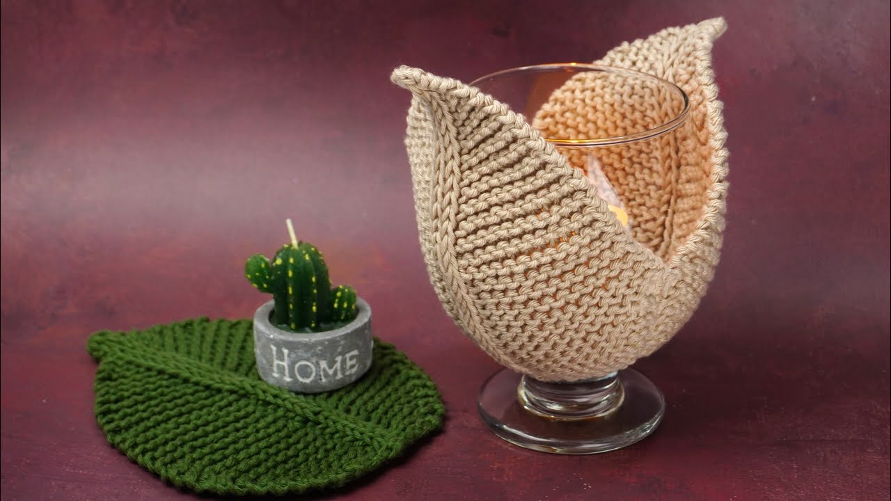 UN PORTA VELAS REALIZADO CON DOS AGUJAS