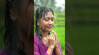 A Beautiful Girl Bathing In The Rain In The Rice Fields