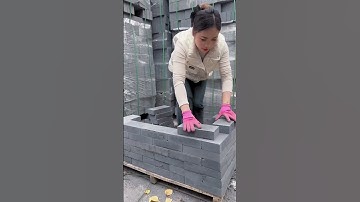 "Girl power in construction! 😎 Watch as this boss lady handles concrete blocks