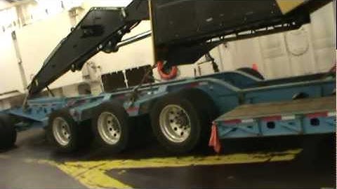 2012 Caterpillar 568LL Log Loader on a Ranger Transport Ltd. K-Line 9 Axle Kenworth lowbed