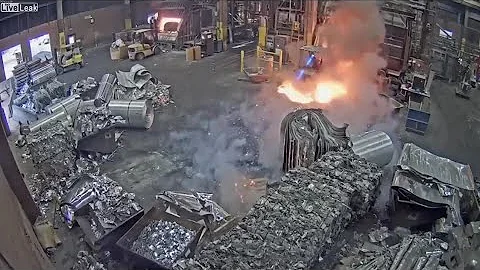Foundry worker puts wet scrap metal in furnace. 💥 #fire #fireplace