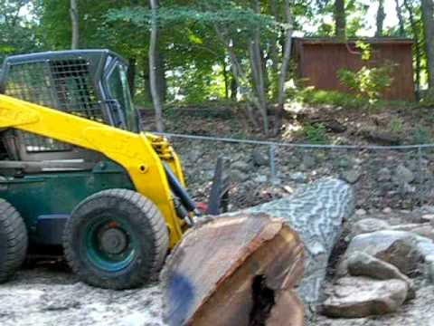 Moving Logblock skid steer moving log - YouTube