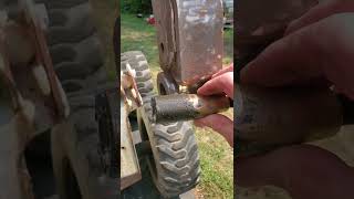 How to remove the pins from a Bobcat Bobtatch... Bottom tapered pins