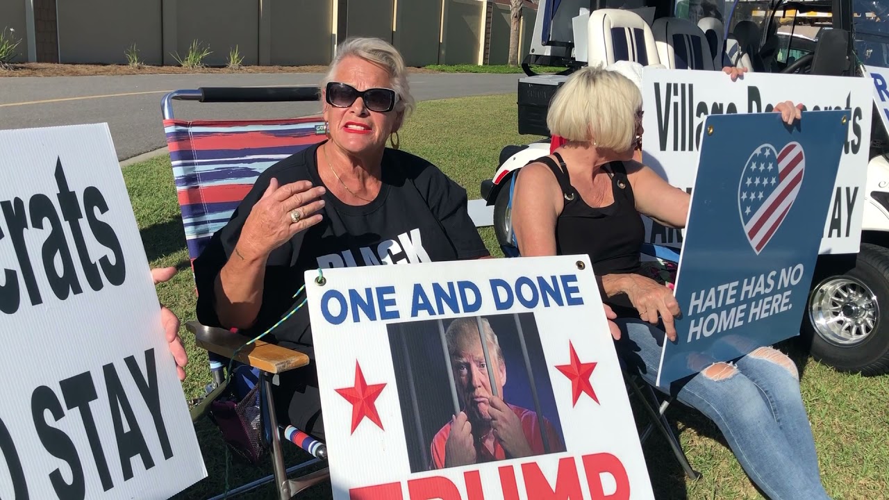 Protestor at Matt Gaetz/Marjorie Taylor Greene America First rally in The Villages