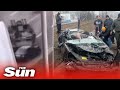 Ukraine invasion - TANK crushes civilian car in Kyiv but driver is miraculously rescued alive