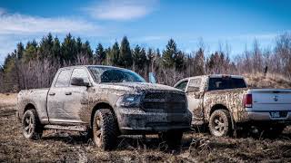 Ram 1500 and GMC playing in mud