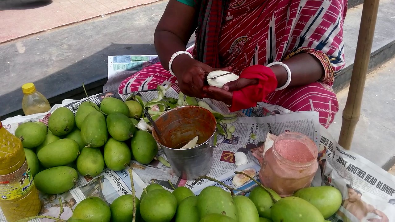 healthy pickled beets Indian street food ! Amazing tasty and healthy raw pickle of young green mango , Kolkata , Bengal