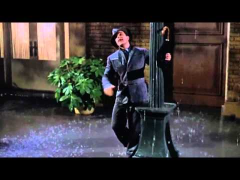 Vamos cantar e dançar na chuva com Gene Kelly!   