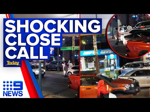 Pedestrians run for life as stolen car mounts gold coast footpath | 9 news australia