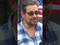 Man tears down flag at Miami Beach bagel shop