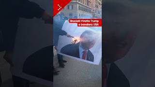 Corteo contro il governo Meloni a Roma: in fiamme bandiera USA e ritratto Donald Trump