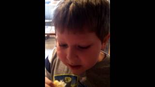 Patrick eating a lemon.