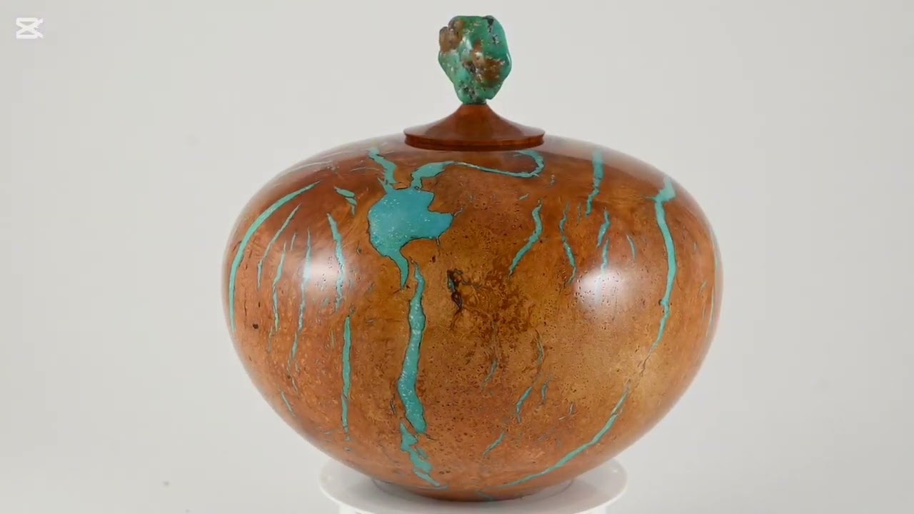 Large handmade wooden urns of Briar Burl with turquoise minerals and on top Turquoise