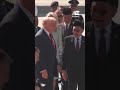 Trump dances with performers, waves flags after landing in Malaysia