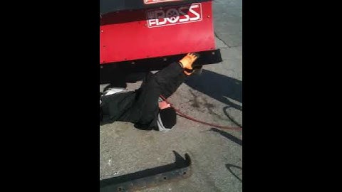 Installing new cutting edge on Boss snowplow