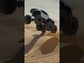 Six wheel bronco sends it over giant sand dunes.