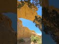 Checking out Dutchman Arch in Utah