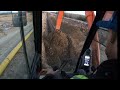 Hoe digging pipeline ditch