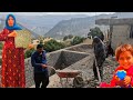 Ahmed and his wife are building a hut with the help of mirza and the workers