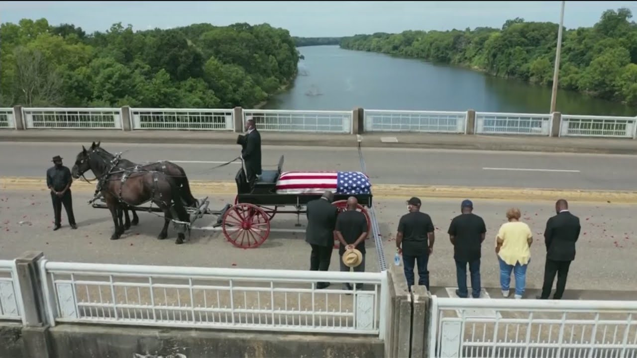 Rep. John Lewis crosses Edmund Pettus Bridge in Selma, Ala. one last time