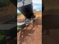 Dumping a load of wood chips with a dump trailer