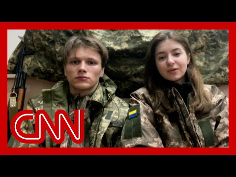 Ukrainian newlyweds take up arms together to defend their country