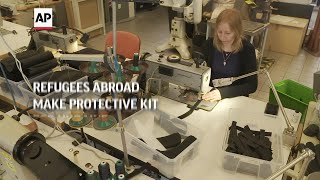 Refugees in Prague make protective kit for Ukraine