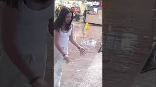 Guy Slipped Trying to Pick up a Cellphone That a Girl Dropped Due to the Rain