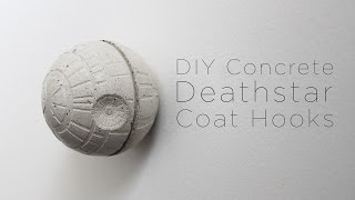 I made this concrete deathstar coat hook using a ice cube mold filled with Quikrete countertop mix. I inserted a wood screw into the 